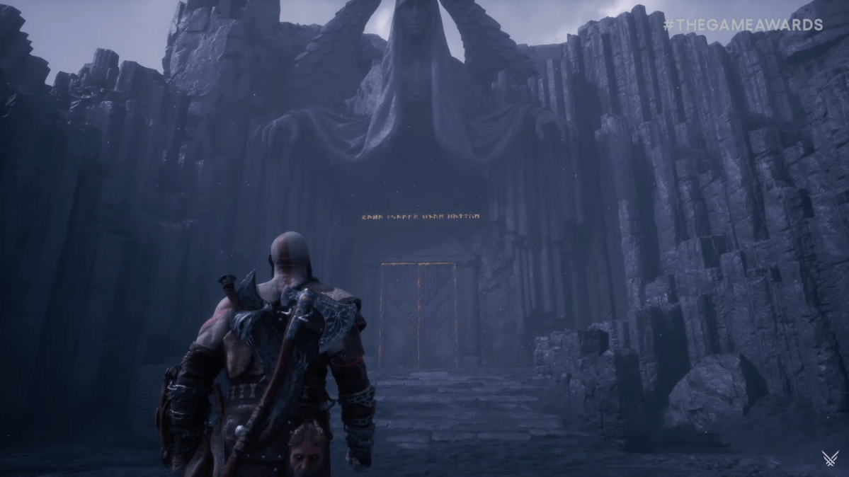 Kratos walking towards a monolithic gate in God of War Ragnarok Valhalla