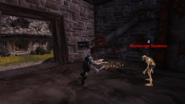 Image of an undead Rogue in World of Warcraft stabbing a skeleton.