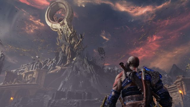 Kratos staring up at giant structure on top of mountain