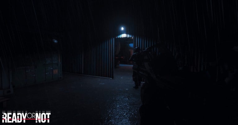 Two players walking into a hangar with a bulb lighting the entrance in Ready or Not