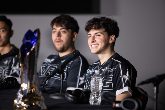 NRG's jungler Contractz smiles for the press with the LCS trophy following NRG's victory over C9 in the 2023 LCS Championship grand finals.