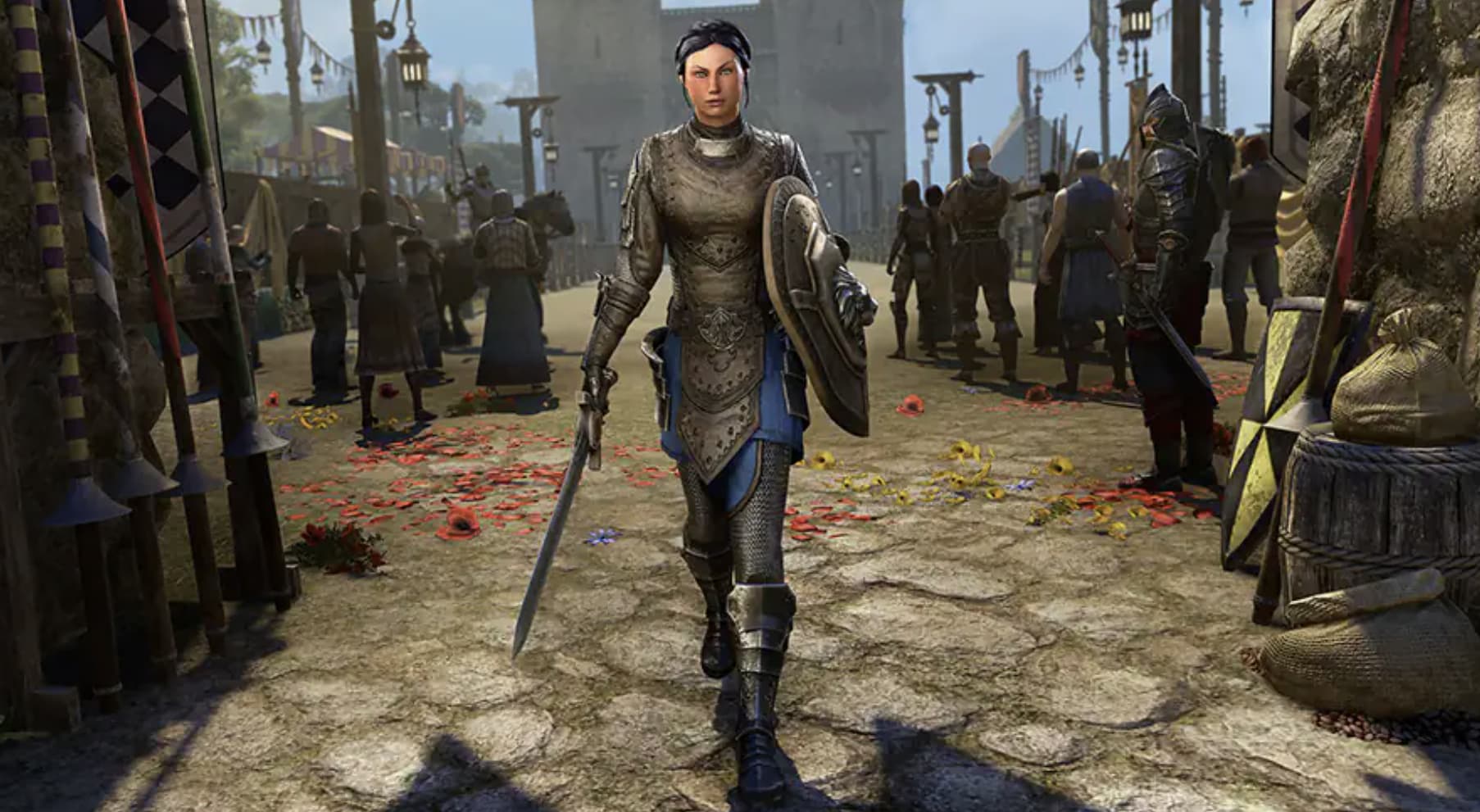 Isobel Veloise, a Breton Templar from ESO, walks towards the camera, in a plate of armor with a sword and shield equipped.