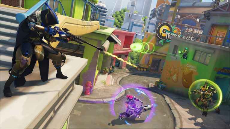 Ana shoots a healing dart toward Zarya in Overwatch 2's Rio map.