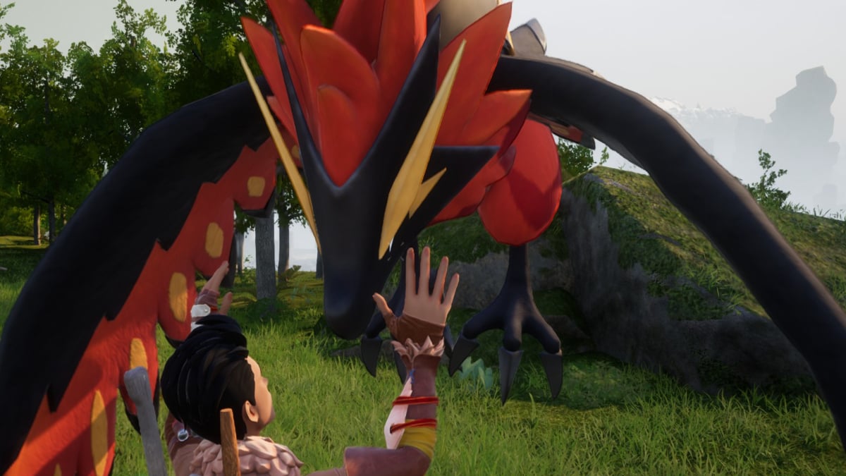 A player in Palworld petting a Ragnahawk.