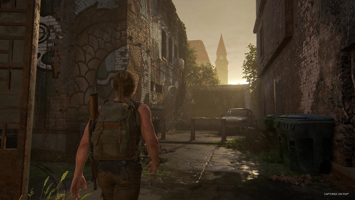 Abby walking through a town in The Last of Us 2 Remastered.