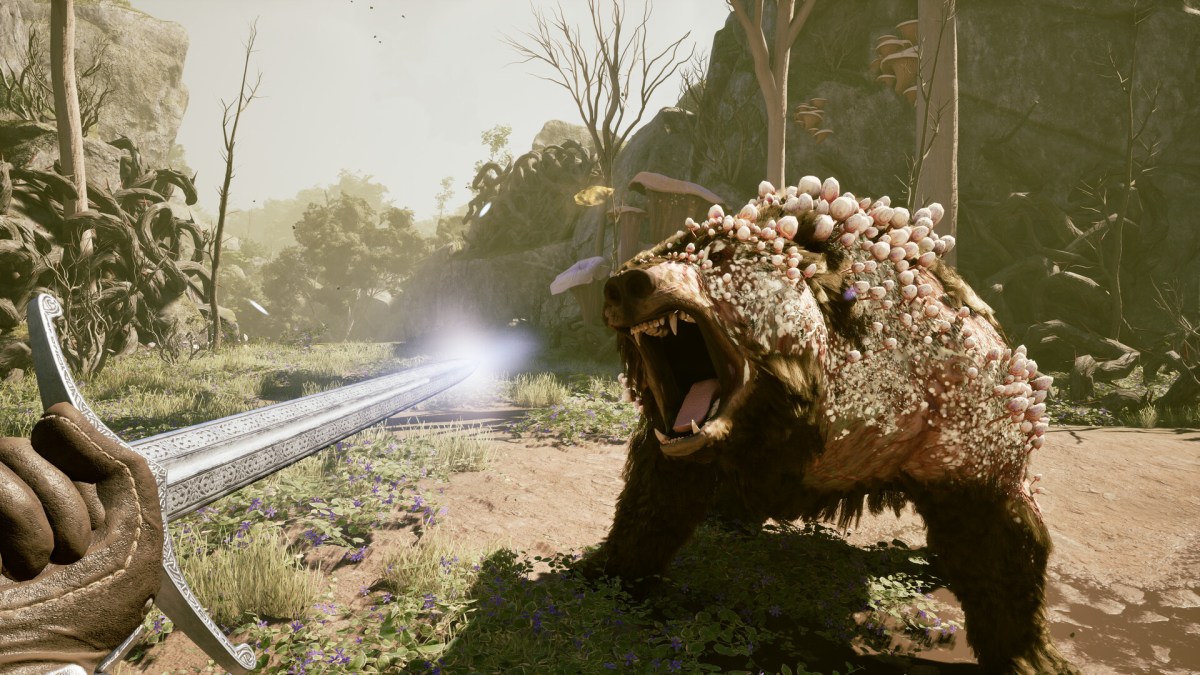 The player facing off a bear in Avowed.