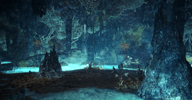 A brightly-lit underground cave in Monster Hunter World.
