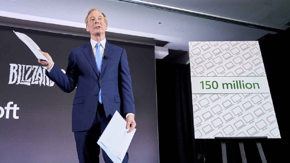 Microsoft president Brad Smith holding envelope and letter