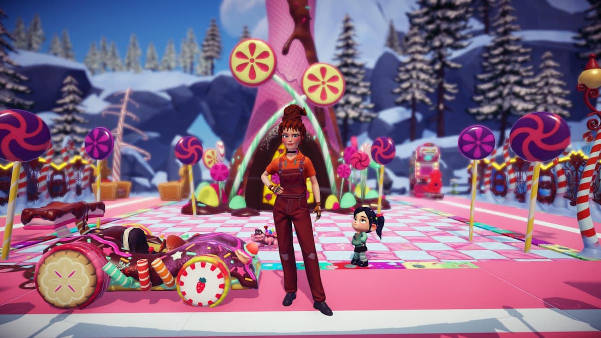 The player dressed as Ralph standing with Vanellope in front of her candy house.