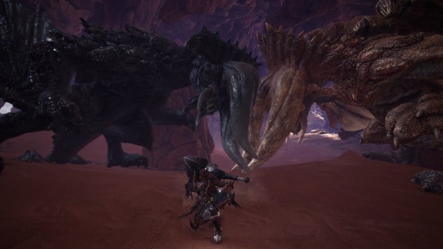 A Diablos and Black Diablos battle in front of a player in Monster Hunter World.