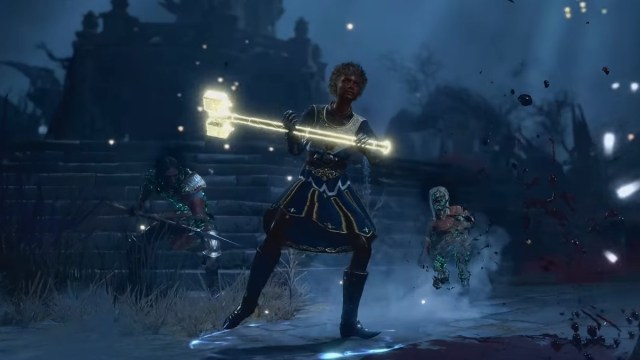 A woman with curly hair and blue armor wields a large, glowing hammer while surrounded by skeletons in BG3.