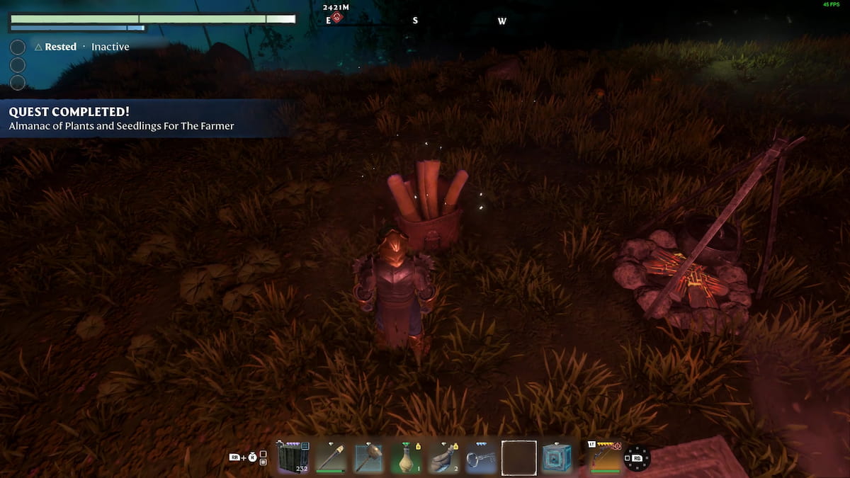 Enshrouded character in front of the Almanac with an extinguished campfire on the right side
