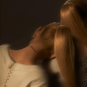 An image of Ariana Grande's Eternal Sunshin album cover, which features two songs in Fortnite Festial. The cover features two versions of ariana sitting next to one another. 