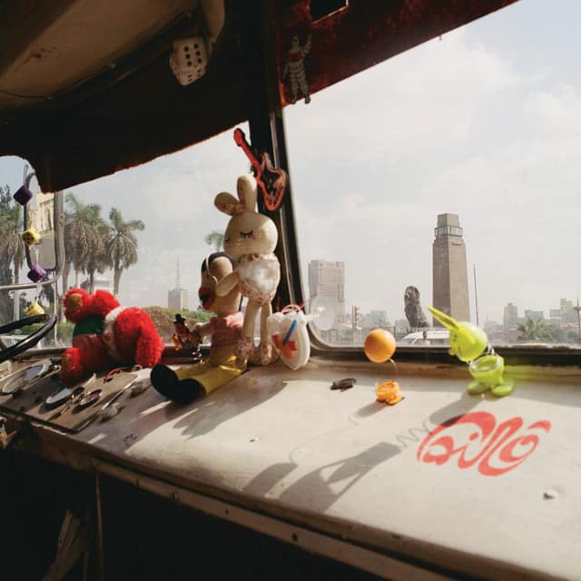 An image from Fortnite Festival of the Cairo cover art, which features stuffed animals on a car dashboard. 