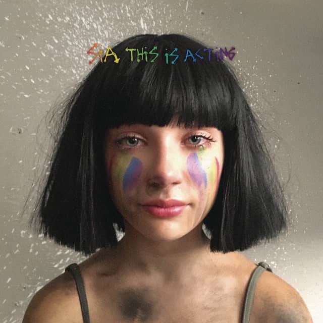 An image of the Cheap Thrills cover art from Fortnite Festival, which showcases Maddie Ziegler in a black wig with rainbow makeup. 
