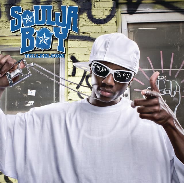 An image from Fortnite Festival of the Crank That (Soulja Boy) cover art. This cover features the artist in an all white outfit standing in front of a house. 