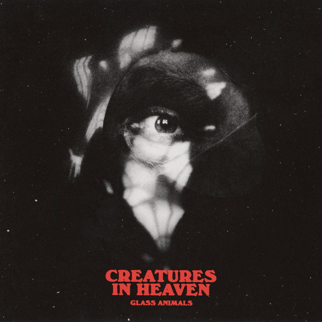 An image of the Creatures In Heaven cover art, from Fortnite Festival. This cover features a black and white eyeball looking through a peek hole. 