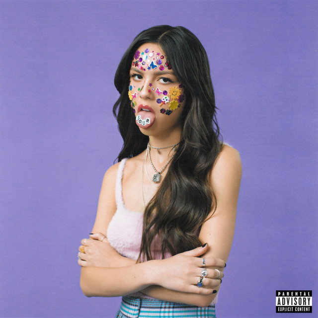 An image from Fortnite Festival of the Good 4 U cover art, which features Olivia Rodrigo with her face covered in stickers. 