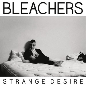 An image of the I Wanna Get Better cover art, a song by Bleachers in Fortnite Festival. This artwork is in black and white and shows a man resting on a bed in a suit. 