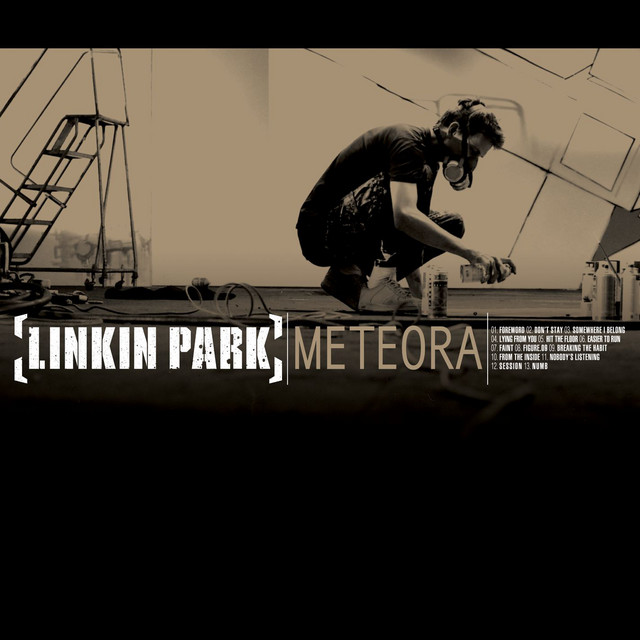 An image from Fortnite Festival ofthe Numb cover art. This Linkin Part cover features a man in a mask spray painting. 