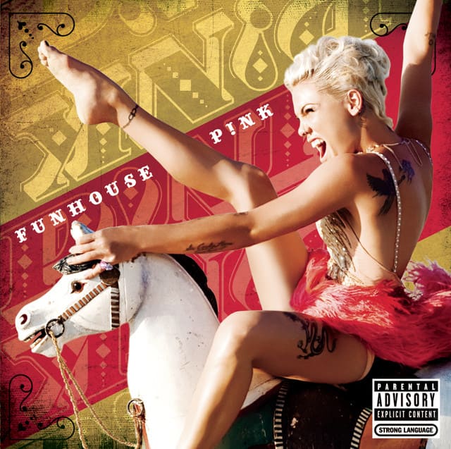 An image of the So What cover art from Fortnite Festival. This showcases the singer riding on a fake horse on a carosel. 
