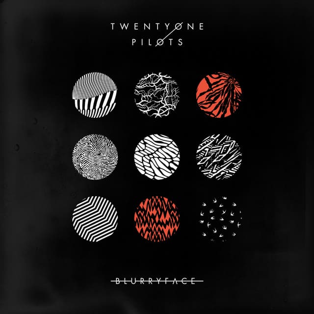 An image of the Stressed Out cover art, which showcases nine red, white and black dots. 