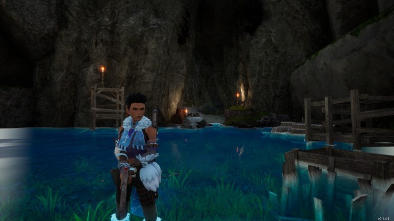 A player in Palworld stood at the entrance to the Shoal Mineshaft where the Broncherry Aqua boss is located.