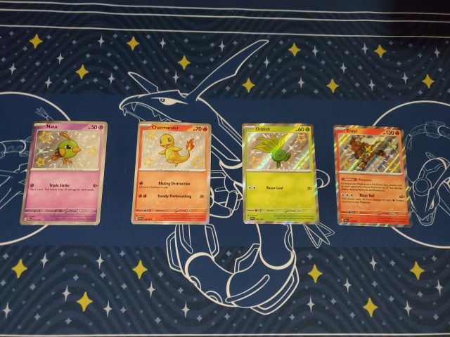 A handful of Shiny cards from Pokemon TCG Paldean Fates.