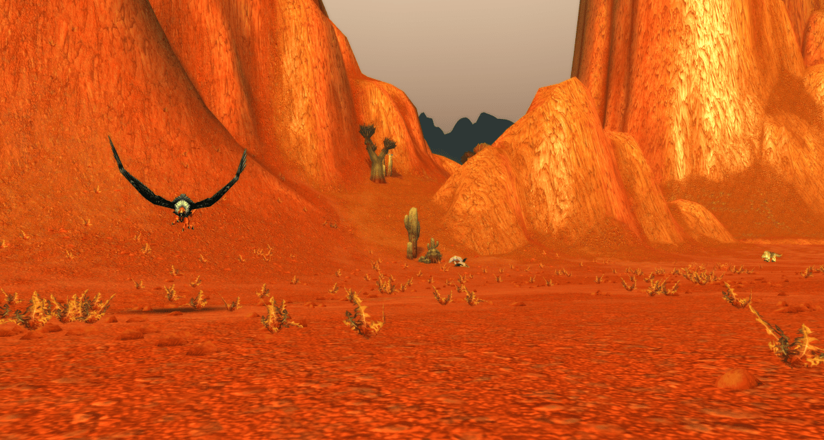 A buzzard charges a player in the Badlands in WoW Classic