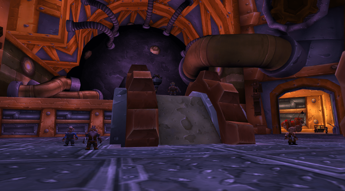 High Tinker Mekkatorque in Ironforge. View of the NPC from the floor as he stands on a giant wheel and cog.
