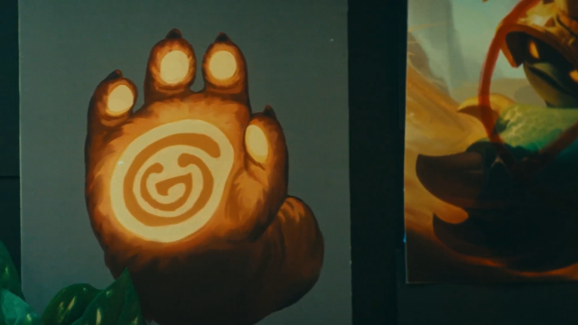 Big hand of an unknown Yordle in TFT Set 11 sneak peak video - Screenshot by Dot Esports