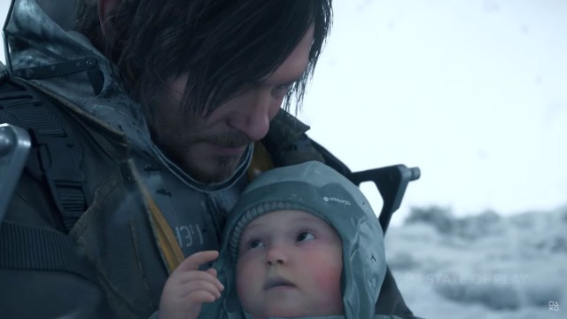 Sam from Death Stranding holding a baby
