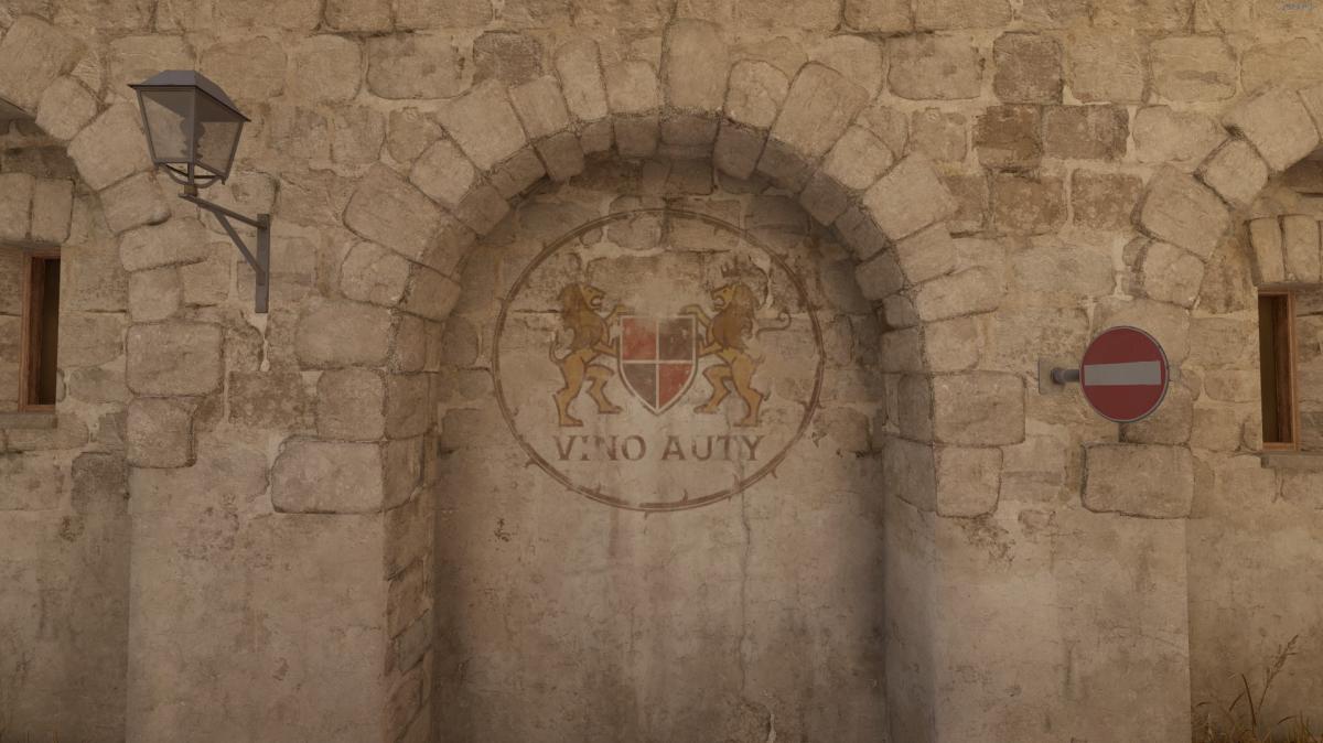 Artwork painted on a wall by a street sign on Inferno in CS2.