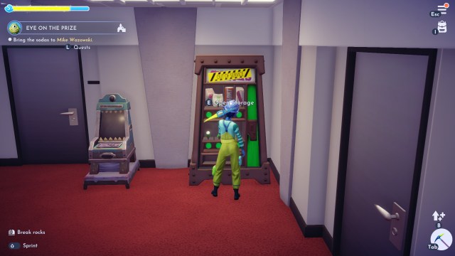 The player about to smash the green vending machine with a pickaxe.