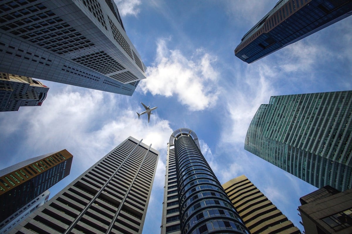 Looking up at a few buildings