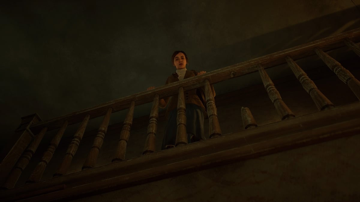 Emily looking over the banister for Edward in Alone in the Dark