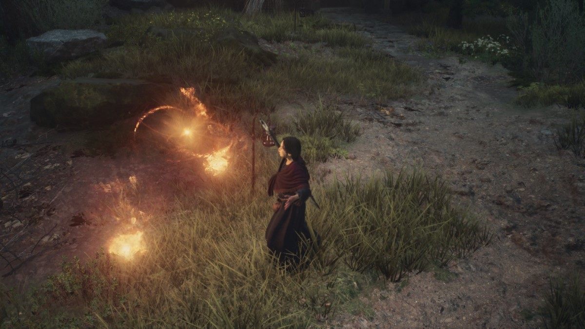 The sorceress Trysha prepares to fire fireballs in Dragon's Dogma 2.
