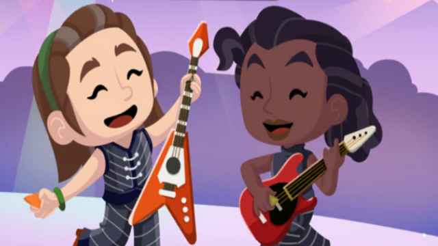 Two singers on stage playing instruments