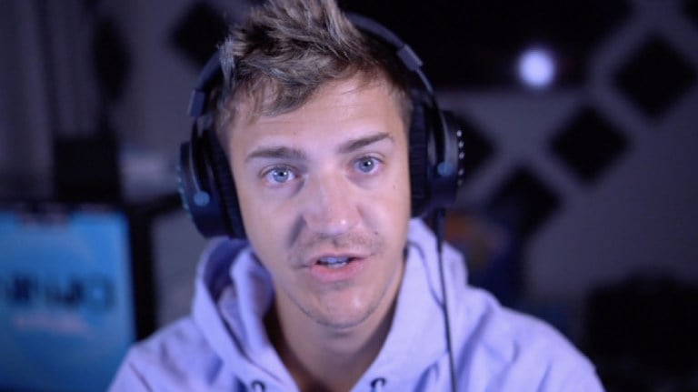 Ninja wearing headphones talking into camera