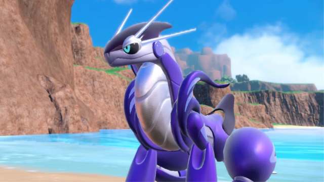 Miraidon sitting on the beach in Pokémon Scarlet and Violet.