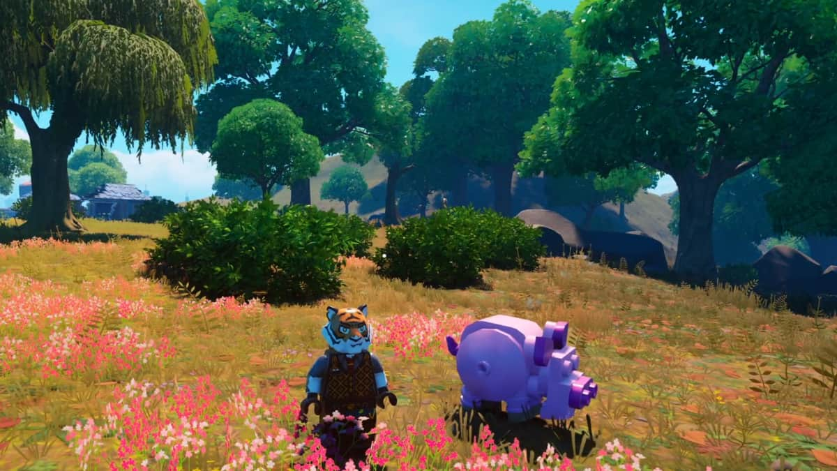 A player in LEGO Fortnite standing alongside a pig.