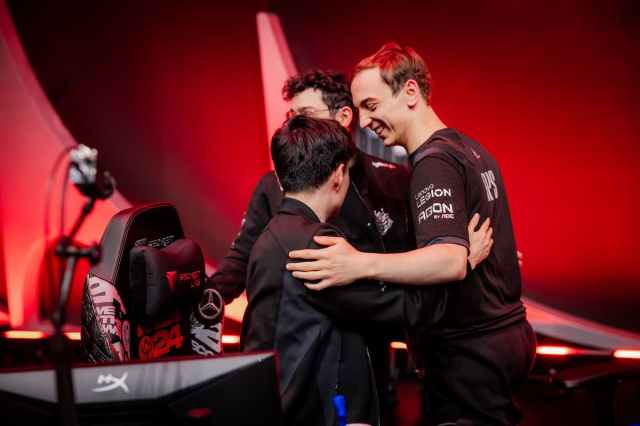 G2 mid laner Caps hugging his teammates after a win at MSI 2024