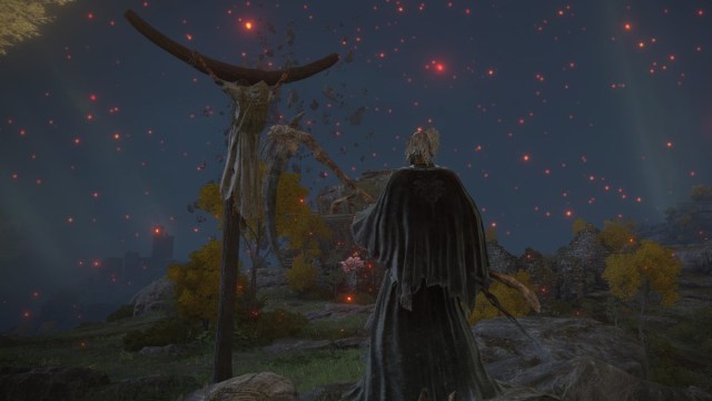 The Grim Reaper in Elden Ring looks at a man on a strange wooden pillar in Elden Ring.