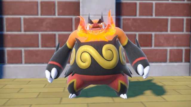 Emboar standing in front of a brick wall in Pokémon Scarlet and Violet.