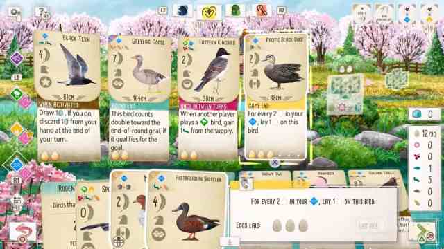 Gameplay of the Wingspan Digital Edition game, including a row of birds producing eggs and other resources.