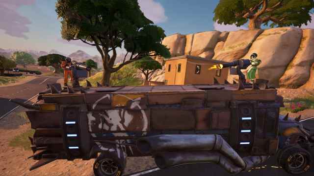 Two players fighting on the War Bus in Fortnite.