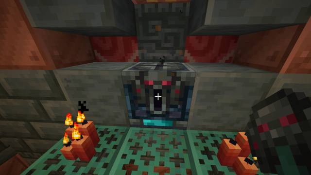 Standing by an Ominous Vault with a key in Minecraft.