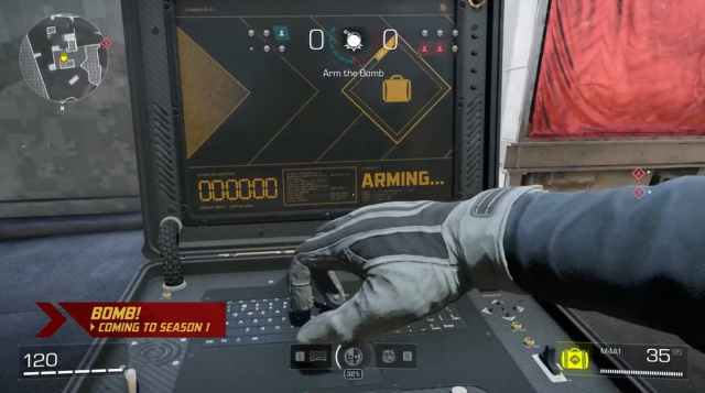 A player planting a bomb in XDefiant's Bomb mode.