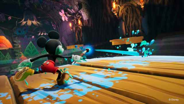 Picture showing Mickey using the paint to make way for himself in Epic Mickey Rebrushed.