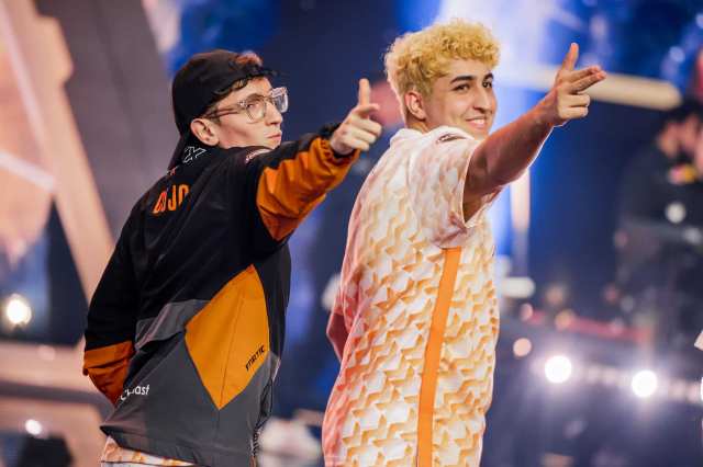 Jake "Boaster" Howlett, on the left, and Emir "Alfajer" Beder, ont the right of Fnatic are seen on stage mimicking Yusuf Dikec: Türkiye's Olympic 'silver' shooter after their victory against G2 Esports at VALORANT Champions Seoul Playoffs Stage.